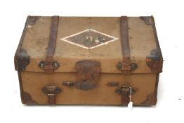 A vintage leather bound trunk. The canvas top stamped ' J S Wood T.H.S.