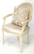 A contemporary Queen Anne style open arm chair.