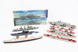 Ten diecast model ships.