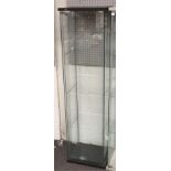 A glass shop display cabinet.