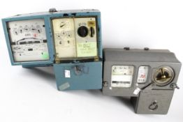 Two vintage prepayment coin operated electricity meters.