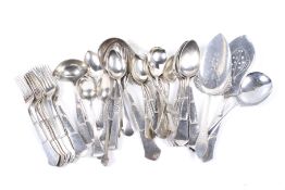 An assortment of 20th century white metal flatware. Including spoons, forks, a cake slice, etc.