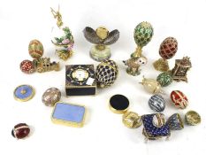 An assortment of enamel items. Including clocks, boxes, eggs, charms, etc.