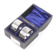 A boxed pair of silver napkin rings.