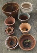 A collection of terracotta plant pots. Some with textured decoration, Max.