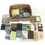 A collection of books, some gardening related.