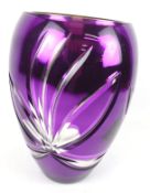 A contemporary mercury vase.