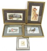 Four woven pictures and a silver plaque printed with a bluetit.