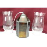 A pair of oil lamp shades and ceiling light.