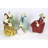 Five Royal Doulton figures.