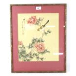 An oriental silk picture of birds and blossom.