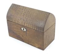 A vintage brown crocodile skin box.