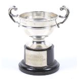 A silver small campana shaped trophy cup.