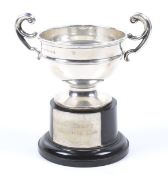 A silver small campana shaped trophy cup.