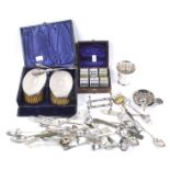 An assortment of silver plate and a pair of hammered-silver mounted oval clothes brushes.