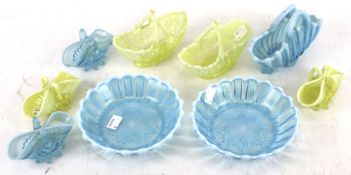 A collection of early 20th century press moulded vaseline glass baskets and dishes.
