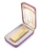 A vintage boxed Dunhill gold plated cigarette lighter. With textured decoration, L6.