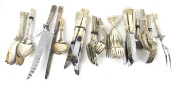 A collection of silver plated flatware.