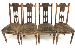 A set of four 20th century wooden chairs.