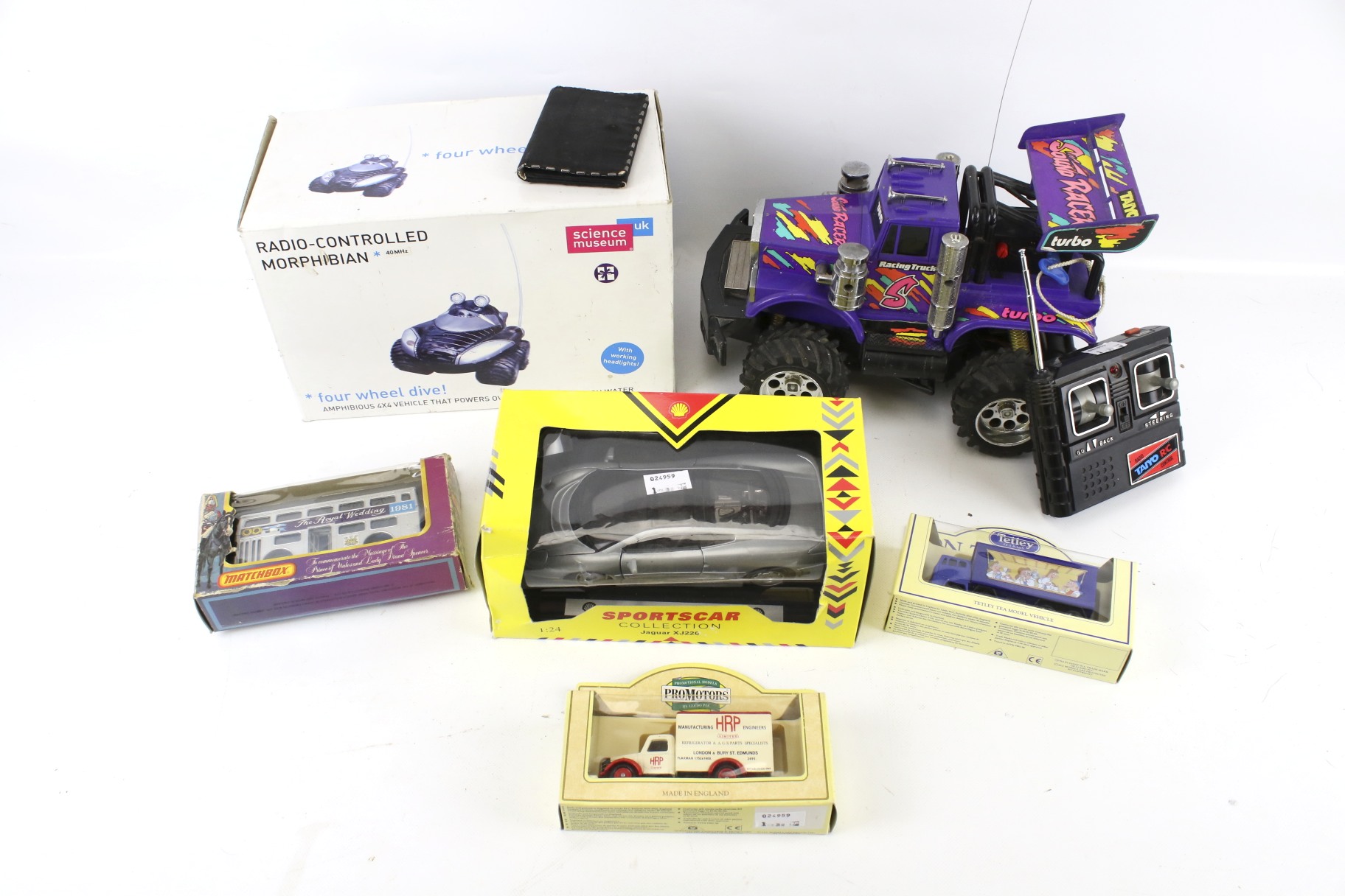 A collection of diecast model cars and two radio control vehicles. Including Matchbox, etc.