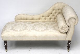 A small chaise lounge.