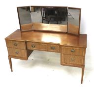 A contemporary wooden dressing table.