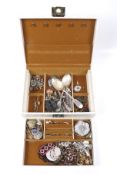 An assortment of costume jewellery. Including brooches, rings, earrings, etc.