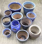 A collection of blue glazed plant pots. Of various sizes and designs. Max.