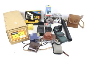 An assortment of vintage cameras and photographica.