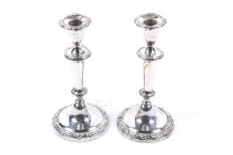 A large pair of silver plated candlesticks.