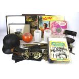 An assortment of collectables. Including a vintage motorbike helmet, LP records, prints, etc.