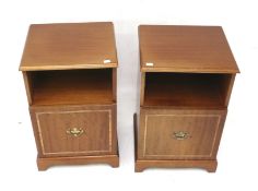 A pair of contemporary bedside cabinets.