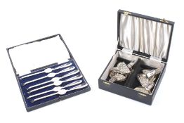 Two boxed sets of silver plated dining implements.