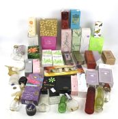 A collection of vintage purfume bottles. Including Avon, Yves Rocher, etc, some unused.