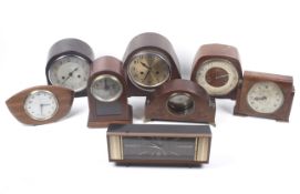 A collection of clock lenses and watch components.