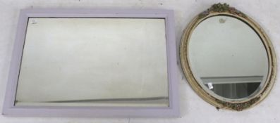 Two bevelled edge wall mirrors.