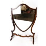 A early 20th century mahogany veneered swing mirror.