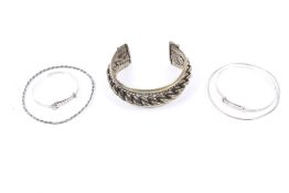 Five marked silver bangles.