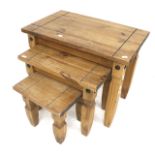 A contemporary nest of three pine tables. Of rectangular form, raised on shaped block supports, Max.