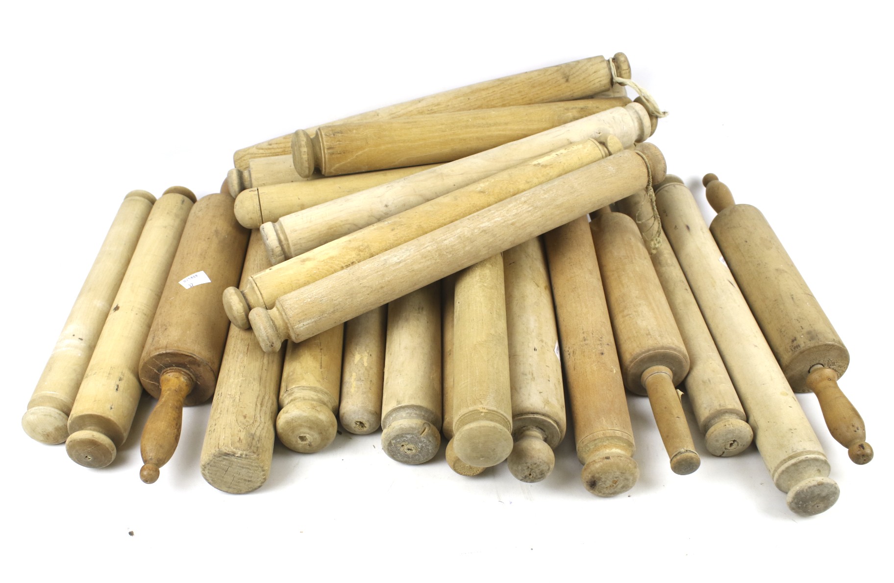 A collection of vintage wooden rolling pins.