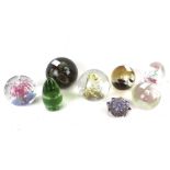 A collection of glass paperweights. Including Caithness 'Wise Owl', etc.