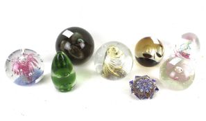 A collection of glass paperweights. Including Caithness 'Wise Owl', etc.