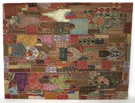 A contemporary Indian patchwork fabric wall hanging.