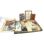 An assortment of military interest ephemera. Including books, documents, newspapers, etc.