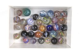 A collection of vintage hand blown glass marbles.