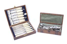 An assortment of silver-plated small flatware and other items.