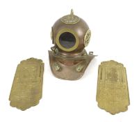 A scaled model diver's helmet and a pair of American door plates.