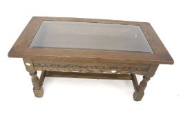 A contemporary oak coffee table/display cabinet.