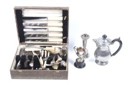 An assortment of silver plate and metalware. Including flatware, a posy holder, pewter stein, etc.