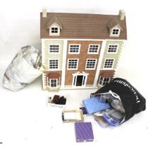 A contemporary dolls house and accessories.